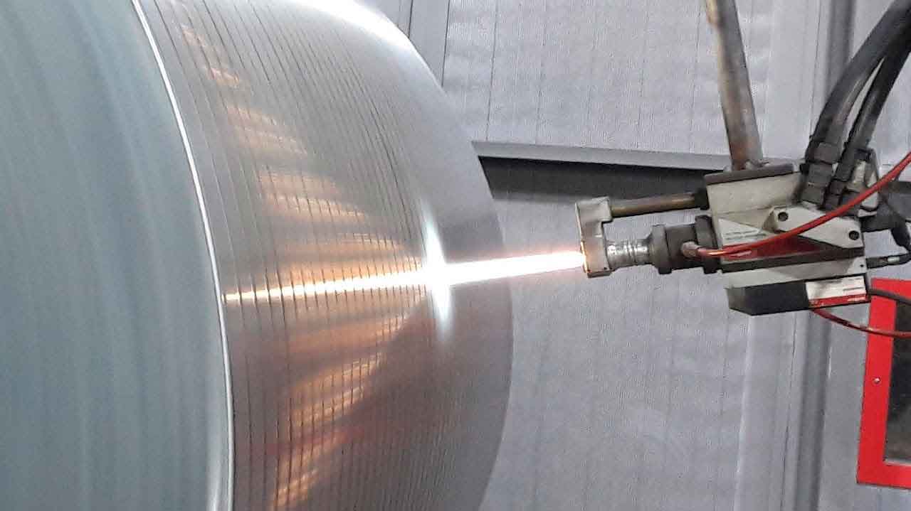 HVOF tungsten carbide coating on a rotating component at a VILA factory